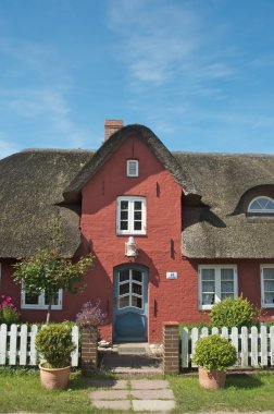 Thatched-roof house clipart