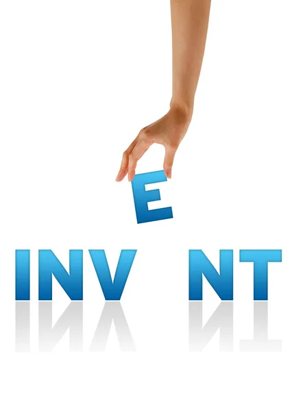 Mano sosteniendo E de la palabra Inventar —  Fotos de Stock