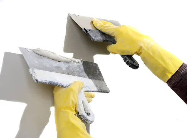 stock image Woman in yellow gloves plasters