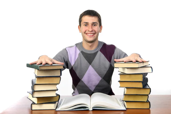 Guy sitting among the books — Stock Photo, Image