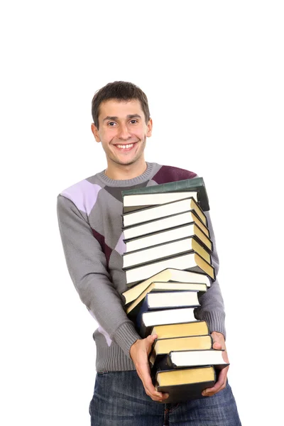 Joven sosteniendo pila de libros — Foto de Stock