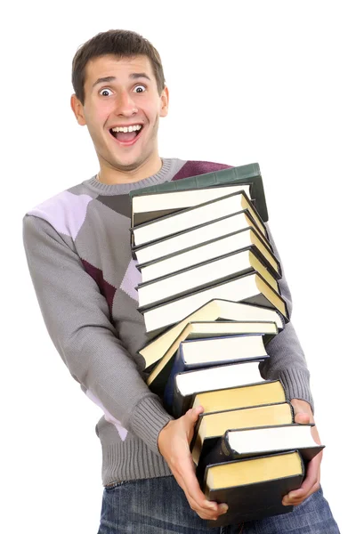 Joven sosteniendo pila de libros — Foto de Stock