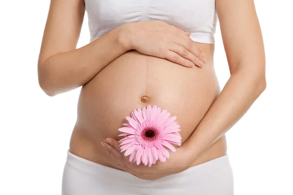 Gravid kvinna med blomma — Stockfoto