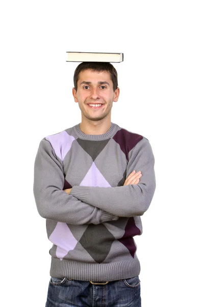 Portrait of student with book on the head on a white background Stock Photo
