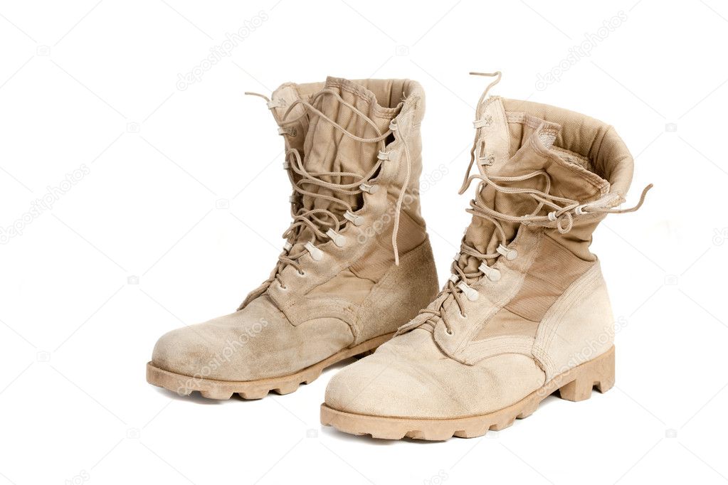 Pair of old, well worn, military boots. Isolated on white background