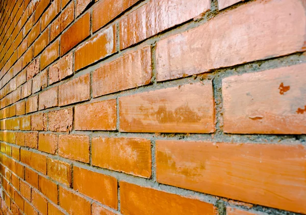 Πλάνο λεπτομέρειες από έναν τοίχο από τούβλα πορτοκαλί-καφέ. — Φωτογραφία Αρχείου