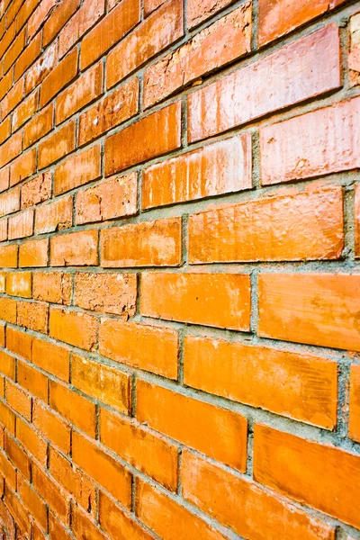 Detalles de cerca de una pared de ladrillo marrón anaranjado . —  Fotos de Stock