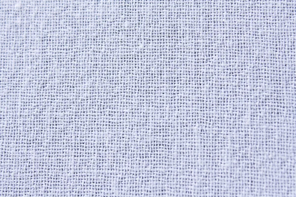 Текстура ткани из белого хлопка на заднем плане — стоковое фото
