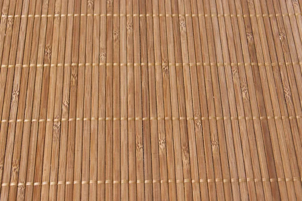 Bakgrunden bambu pinnar med tråd förenar — Stockfoto