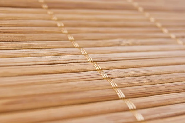 Achtergrond bamboe stokken met draad verenigen — Stockfoto