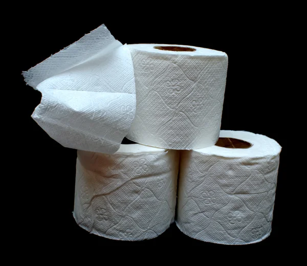 stock image Rolls of white toilet paper on a black background.