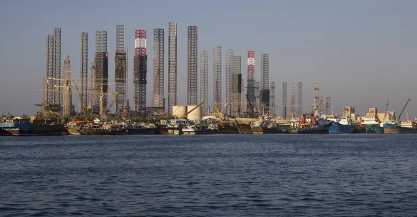 stock image Drilling rig and vessels in the port