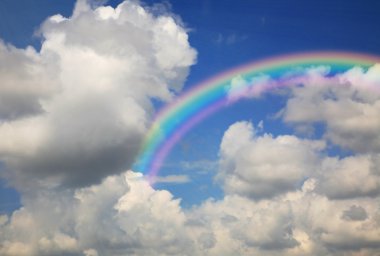 Blue sky with clouds and rainbow clipart