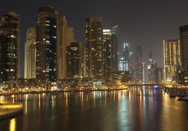 Town scape at night time. Panoramic scene, Dubai. clipart