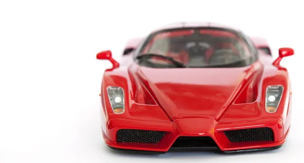 Red sport car miniatura su sfondo bianco — Foto Stock