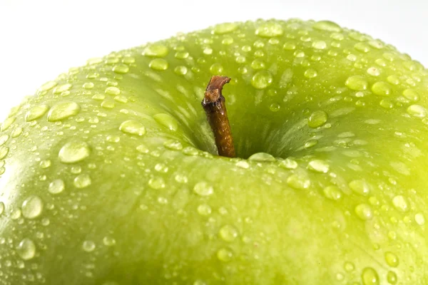 stock image Green apple with water drops