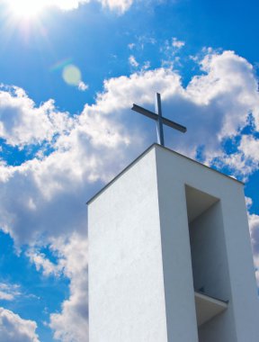 Cross on Christian Church Under Blue Sky clipart