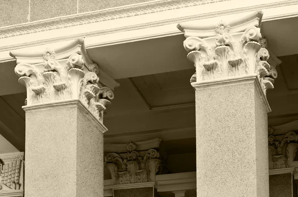 Close-up of classic columns in black and white