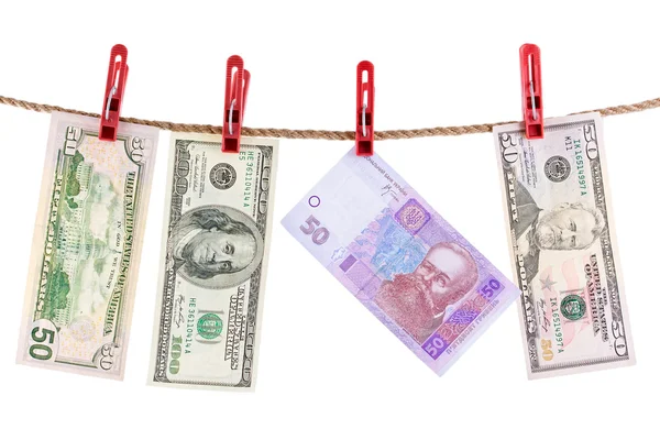 American and Ukrainian currencies is dry on the rope. Royaltyfria Stockfoton