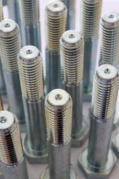 stock image Metal bolts over white and closeup