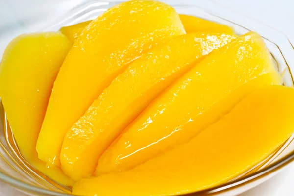 stock image Sweet dessert: Mango slice in syrup