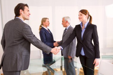 Businessman and businesswoman during a working meeting clipart