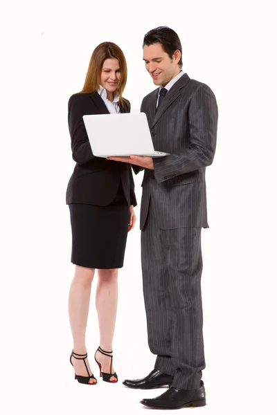 Бизнесмен и деловая женщина с ноутбуком — стоковое фото