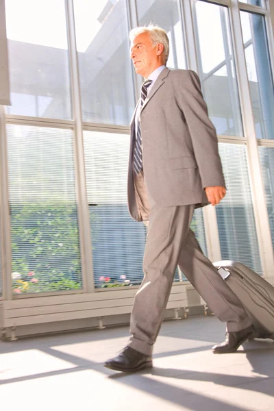 Businessman with trolley — Stock Photo, Image