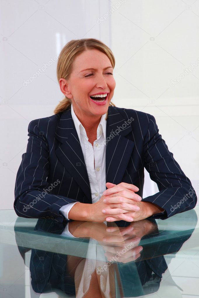One woman in office at the desk