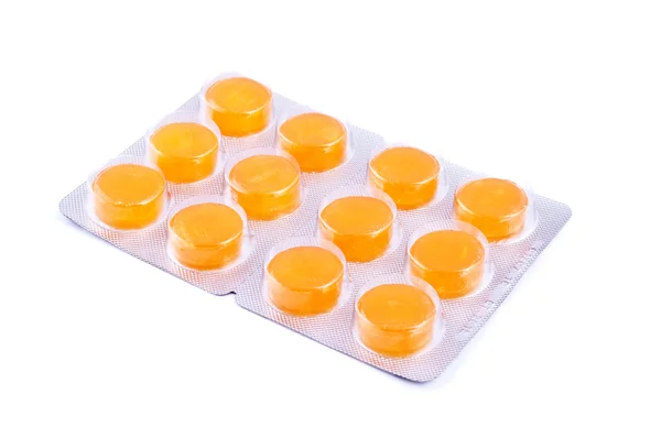 Pacote de comprimidos amarelos — Fotografia de Stock