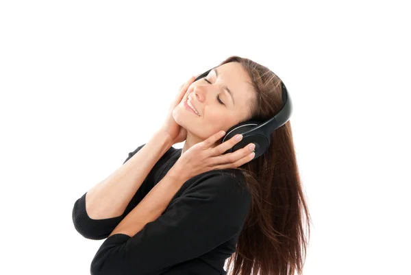 Mujer escuchar y disfrutar de la música relajante en los auriculares —  Fotos de Stock