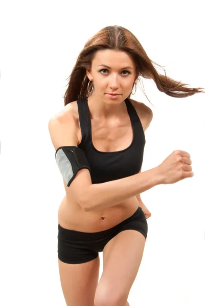 Kobieta szczupła brunetka sport jogging i działa, słuchając nieskonczoność — Zdjęcie stockowe