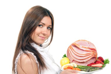 Woman holding a plate with sliced ham clipart