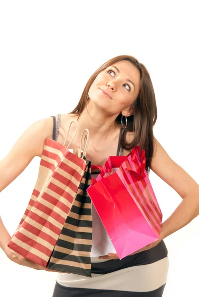 Mujer de pie, con tarjeta de crédito y bolsas de compras en la mano —  Fotos de Stock