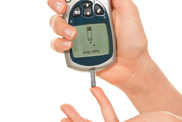 Diabetic patient measuring glucose level blood test — Stock Photo, Image