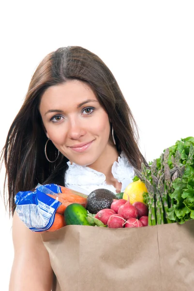 Donna che tiene una borsa della spesa piena di generi alimentari vegetariani — Foto Stock