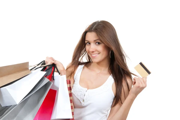 Donna in piedi, in possesso di carta di credito e borse della spesa in mano — Foto Stock
