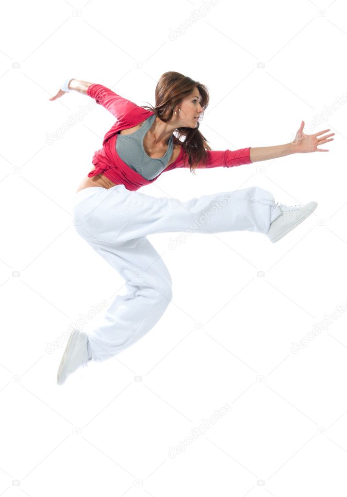 Pretty modern slim hip-hop style woman dancer jumping and dancin