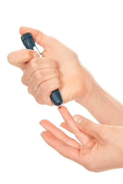 Finger prick for glucose sugar measuring level blood test — Stock Photo, Image