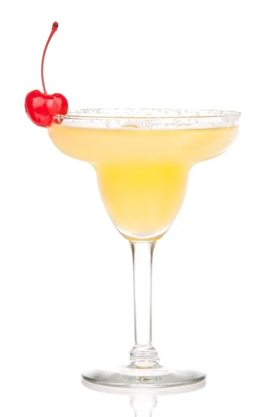 Yellow margarita cocktail with red cherry in chilled salt rimmed — Stock Photo, Image