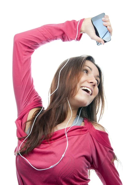 女孩听、 享受音乐和控股蜂窝 mp3 播放器 — 图库照片