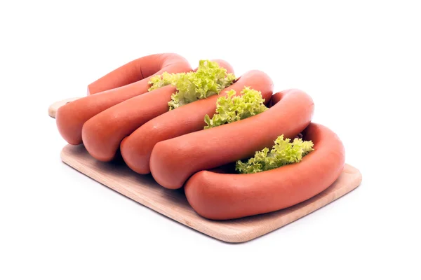 Stock image Delicious sausages, served on platter, decorated with vegetables