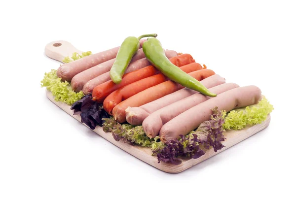 stock image Delicious sausages, served on platter, decorated with vegetables