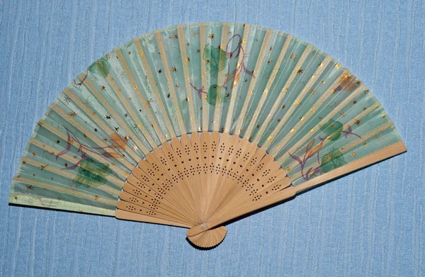Decorative fan on a wall — Stock Photo, Image