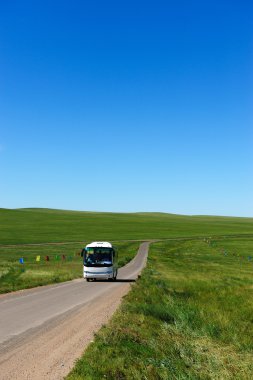 Bus in grassland clipart