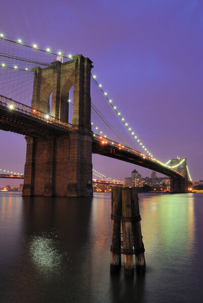 The Brooklyn Bridge shimmering at night.