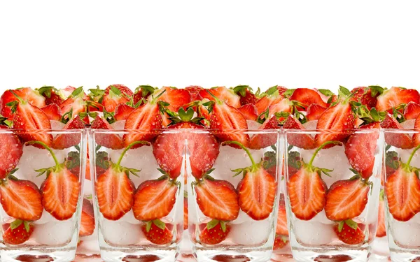 Strawberry by halves in glass with ice — Stock Photo, Image