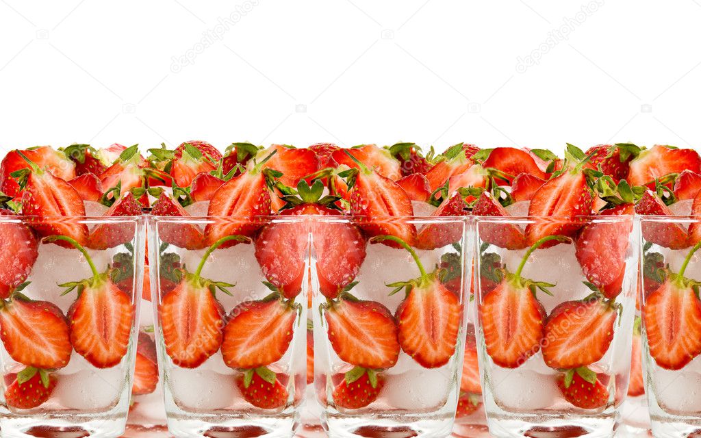 Strawberry by halves in glass with ice