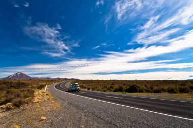 Car Heading Mount Ngauruhoe in New Zealand clipart