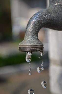 Dripping garden faucet tap close up clipart